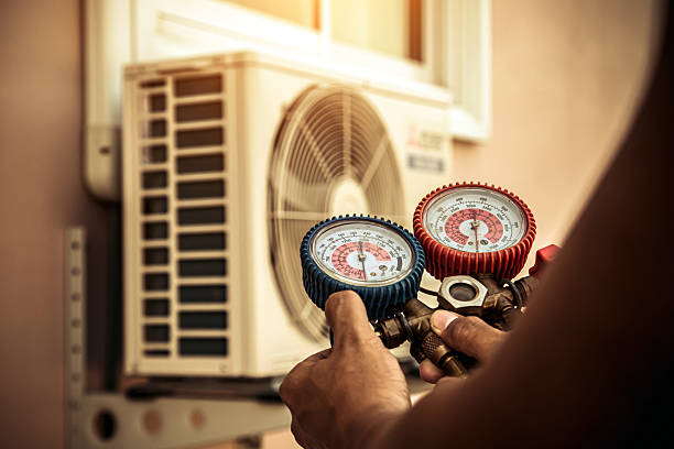 Professional Air Conditioning Service technician working in Arlington Heights, PA